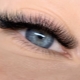 What does the D-curl of eyelashes look like and to whom does it fit?