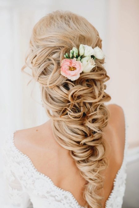 Fresh flowers in a wedding hairstyle