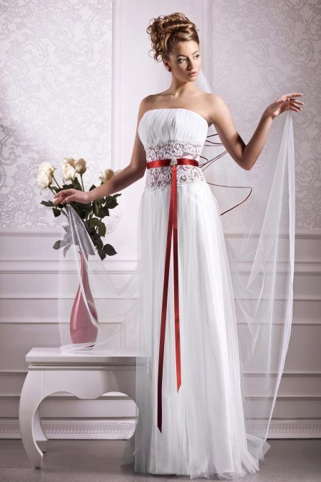 Empire style wedding dress with a red belt