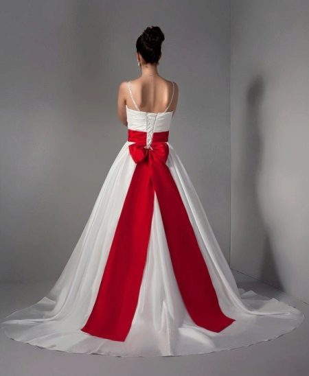 Red wedding dress with a belt and a ribbon in her hair