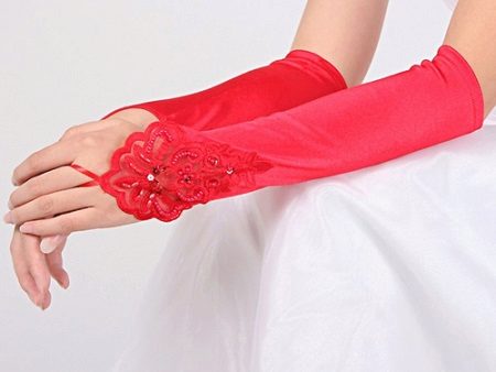 Red gloves to match the red ribbon of a wedding dress