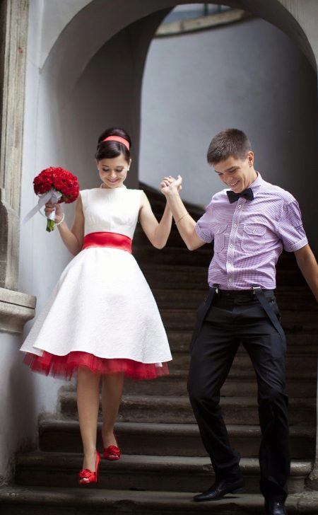 Wedding dress with a red belt and a petticoat