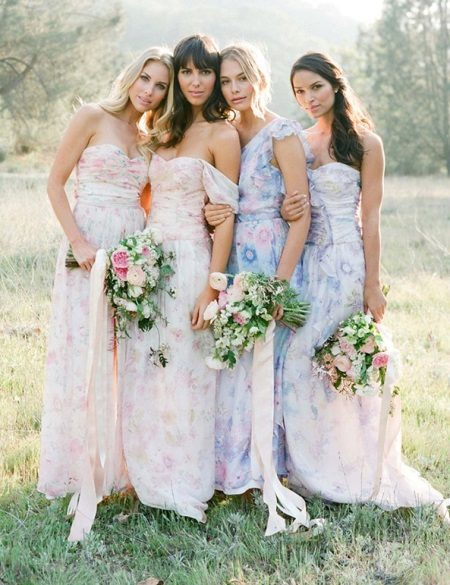 Delicate dresses for bridesmaids on the floor