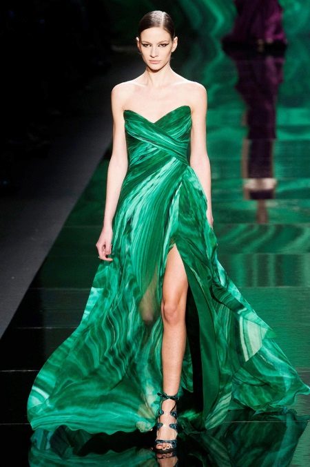 Green dress with a cut evening