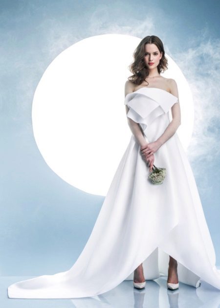 White wedding dress with volumetric elements