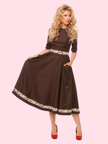 Red shoes under a brown dress