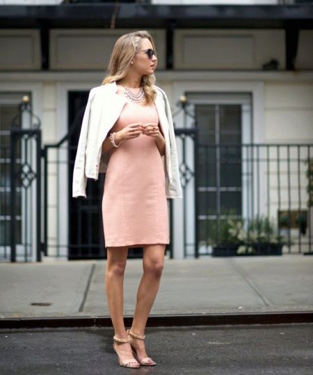 Sheath dress in combination with a jacket