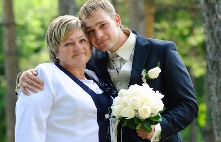 Mom with her son at a wedding