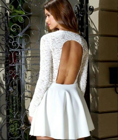 Short white dress with a long sleeve and an open back
