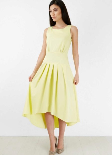 Dress with a low waist with a fluffy asymmetric skirt