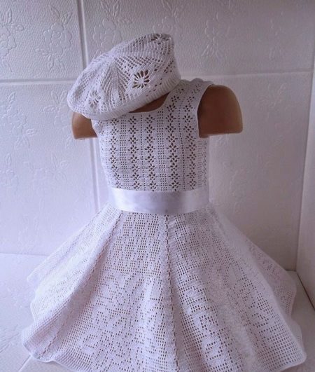 knitted dress for a girl with a filet pattern