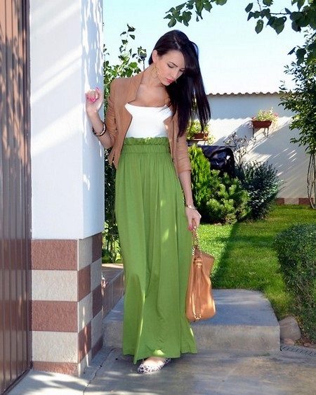 Long green skirt with a half sun in combination with a jacket
